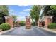 Grand entrance with brick pillars and manicured landscaping welcomes you home at 3101 Howell Mill Nw Rd # 301, Atlanta, GA 30327