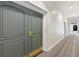 Condo gray double doors featuring brass hardware and an entry hallway with neutral carpet at 3101 Howell Mill Nw Rd # 301, Atlanta, GA 30327