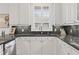 Bright kitchen featuring granite countertops, white cabinets, stainless steel appliances and hardwood floors at 3101 Howell Mill Nw Rd # 301, Atlanta, GA 30327