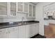 Bright kitchen with white cabinets, black countertops and hardwood floors offers style and utility at 3101 Howell Mill Nw Rd # 301, Atlanta, GA 30327
