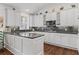 Gourmet kitchen features granite countertops, stainless appliances and white cabinetry at 3101 Howell Mill Nw Rd # 301, Atlanta, GA 30327