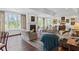 Bright living room with hardwood floors, fireplace, and serene views from large windows at 3101 Howell Mill Nw Rd # 301, Atlanta, GA 30327