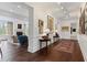 Open concept living room with hardwood floors, neutral decor, and an adjoining gallery at 3101 Howell Mill Nw Rd # 301, Atlanta, GA 30327