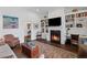 Inviting living room features a cozy fireplace with custom built-ins and a classic rug at 3101 Howell Mill Nw Rd # 301, Atlanta, GA 30327