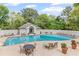 The pool area features plenty of seating, and a bathhouse is surrounded by lush landscaping and greenery at 3101 Howell Mill Nw Rd # 301, Atlanta, GA 30327