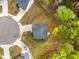 Aerial view of a home featuring a well-maintained yard and a circular driveway in a quiet neighborhood at 3736 Chevington Se Ct, Atlanta, GA 30354