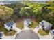 Expansive aerial view of a neighborhood surrounded by lush trees, with well-manicured lawns at 3736 Chevington Se Ct, Atlanta, GA 30354