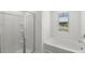Bright bathroom featuring a separate shower and tub with a window at 3736 Chevington Se Ct, Atlanta, GA 30354