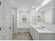 Bright bathroom featuring dual sinks, tub, separate shower, and great natural light at 3736 Chevington Se Ct, Atlanta, GA 30354