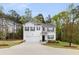 Beautiful two-story home featuring a well-kept lawn and a two-car garage, creating a welcoming atmosphere at 3736 Chevington Se Ct, Atlanta, GA 30354
