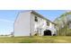 Two-story home with white siding, a patio, and a generous yard, perfect for Gathering enjoyment at 3736 Chevington Se Ct, Atlanta, GA 30354