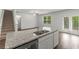 This kitchen is equipped with stainless steel appliances, modern sink, and granite countertops at 3736 Chevington Se Ct, Atlanta, GA 30354