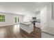Modern kitchen with stainless steel appliances, granite countertops, and an island with a sink at 3736 Chevington Se Ct, Atlanta, GA 30354