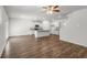 Open concept living space featuring modern kitchen with a kitchen island and hardwood floors at 3736 Chevington Se Ct, Atlanta, GA 30354