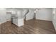 Open concept living area connecting the kitchen, living, and dining spaces with hard surface floors at 3736 Chevington Se Ct, Atlanta, GA 30354