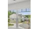 Bright view from a window showing suburban street, homes, and greenery at 3736 Chevington Se Ct, Atlanta, GA 30354