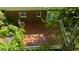 Aerial view from above the wooden deck looking down towards the brick house at 5145 Davantry Dr, Dunwoody, GA 30338