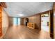 Finished basement features wood paneling, light floors, and an open doorway at 5145 Davantry Dr, Dunwoody, GA 30338