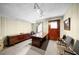 Finished basement area with classic decor and wooden desk and chairs at 5145 Davantry Dr, Dunwoody, GA 30338