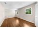 Spacious bedroom boasting two bright windows and hardwood flooring at 5145 Davantry Dr, Dunwoody, GA 30338