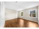 Bright bedroom with hardwood floors and two windows at 5145 Davantry Dr, Dunwoody, GA 30338