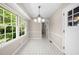 Bright breakfast nook with large window, tiled flooring, and natural light at 5145 Davantry Dr, Dunwoody, GA 30338