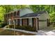 Well-maintained home with an attached garage, brick facade, and classic black shutters at 5145 Davantry Dr, Dunwoody, GA 30338