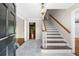Entryway features marble floors, staircase and view into other rooms at 5145 Davantry Dr, Dunwoody, GA 30338