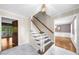 Entryway features marble floors, staircase and view into other rooms at 5145 Davantry Dr, Dunwoody, GA 30338