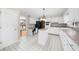 Kitchen with white cabinets, island, and tile flooring at 5145 Davantry Dr, Dunwoody, GA 30338