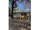 Back exterior view of the home's with a covered area shows backyard's development potential at 5168 Ellen St, Forest Park, GA 30297