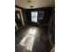 This is an older bedroom showing potential for renovation and modernization, with natural light at 5168 Ellen St, Forest Park, GA 30297
