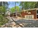 Back of home featuring a wooden deck, double doors, and a basketball hoop at 671 Valley Green Ne Dr, Atlanta, GA 30342