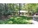 Spacious front yard with mature trees surrounding a classic brick home at 671 Valley Green Ne Dr, Atlanta, GA 30342