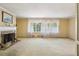 Bright living room showcasing a fireplace, large windows, and natural light at 671 Valley Green Ne Dr, Atlanta, GA 30342