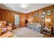 Cozy living room with wood paneling, comfortable seating, and vintage decor at 671 Valley Green Ne Dr, Atlanta, GA 30342
