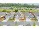 An aerial view of the new construction neighborhood showing manicured lawns and tree lined streets at 807 Bridget Sw Walk, Powder Springs, GA 30127
