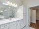 Bright bathroom with a glass shower and a double vanity at 807 Bridget Sw Walk, Powder Springs, GA 30127