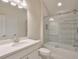 Stylish bathroom featuring a tub-shower combination with horizontal tiling and a sleek vanity at 807 Bridget Sw Walk, Powder Springs, GA 30127