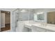 Modern bathroom with glass-enclosed shower and dual vanities at 807 Bridget Sw Walk, Powder Springs, GA 30127