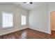 Bright bedroom with beautiful wood floors, neutral walls, and plantation shutters at 807 Bridget Sw Walk, Powder Springs, GA 30127