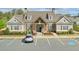 Clubhouse with welcoming stone facade, front parking and manicured landscaping at 807 Bridget Sw Walk, Powder Springs, GA 30127