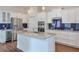 Modern kitchen with white cabinets, granite countertops, stainless steel appliances, and a center island at 807 Bridget Sw Walk, Powder Springs, GA 30127