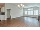 Open concept living room featuring a fireplace, hardwood floors, and lots of natural light at 807 Bridget Sw Walk, Powder Springs, GA 30127