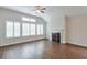 Spacious living room with vaulted ceiling, fireplace, and many windows at 807 Bridget Sw Walk, Powder Springs, GA 30127