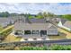Rear exterior featuring outdoor seating areas, and a well manicured lawn at 807 Bridget Sw Walk, Powder Springs, GA 30127