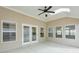 Bright sunroom featuring neutral walls, large windows and skylights for ample natural light and a ceiling fan at 807 Bridget Sw Walk, Powder Springs, GA 30127