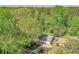 Aerial view of a home surrounded by mature trees with a long driveway at 1590 Arden Sw Dr, Marietta, GA 30008