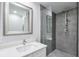 Contemporary bathroom featuring a glass shower, stylish mirror and modern fixtures at 1590 Arden Sw Dr, Marietta, GA 30008