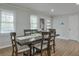Bright dining room with hardwood floors, a modern light fixture, and ample natural light at 1590 Arden Sw Dr, Marietta, GA 30008